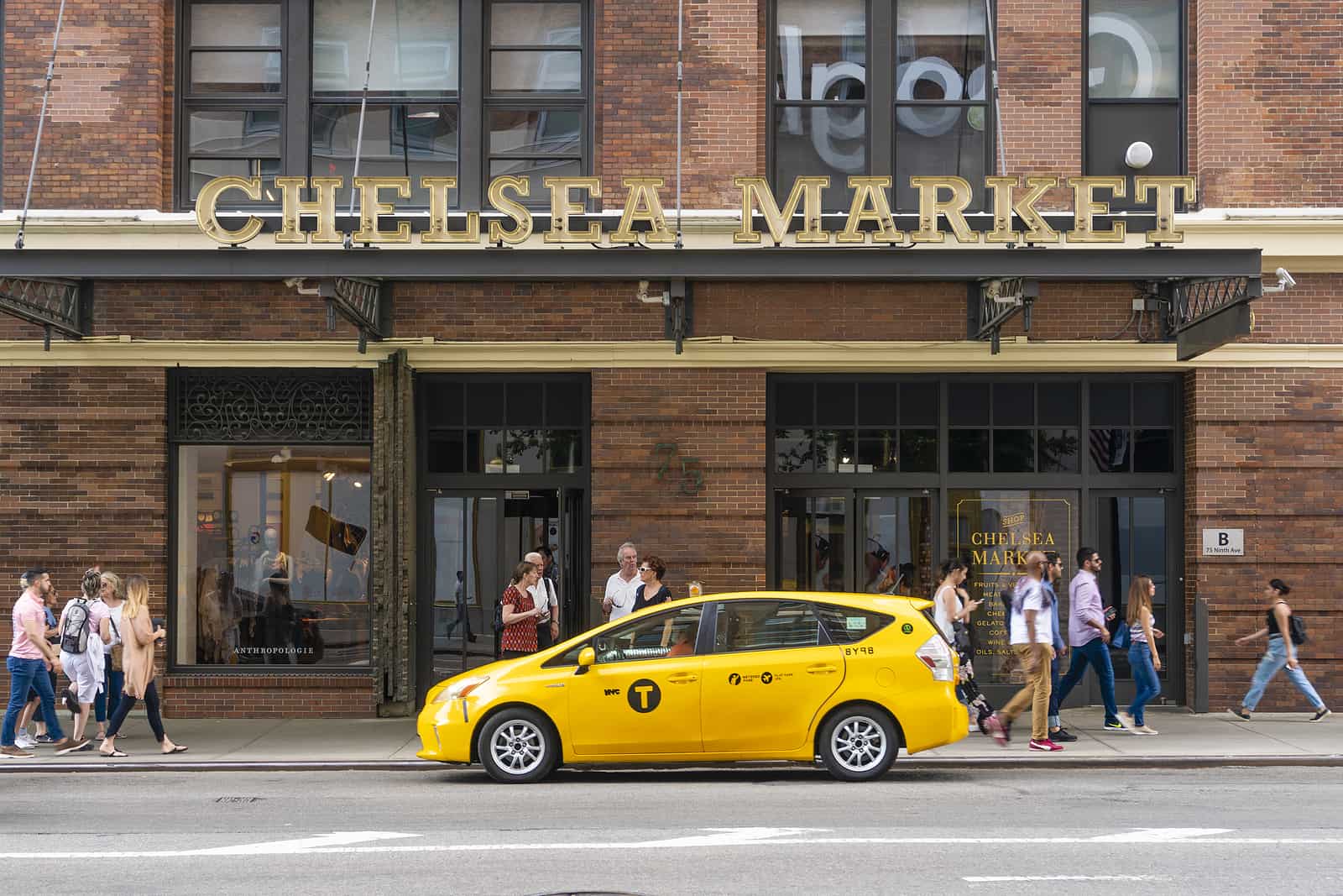 People visiting Chelsea Market in New York City. It is a food hall and shopping mall located in Manhattan.